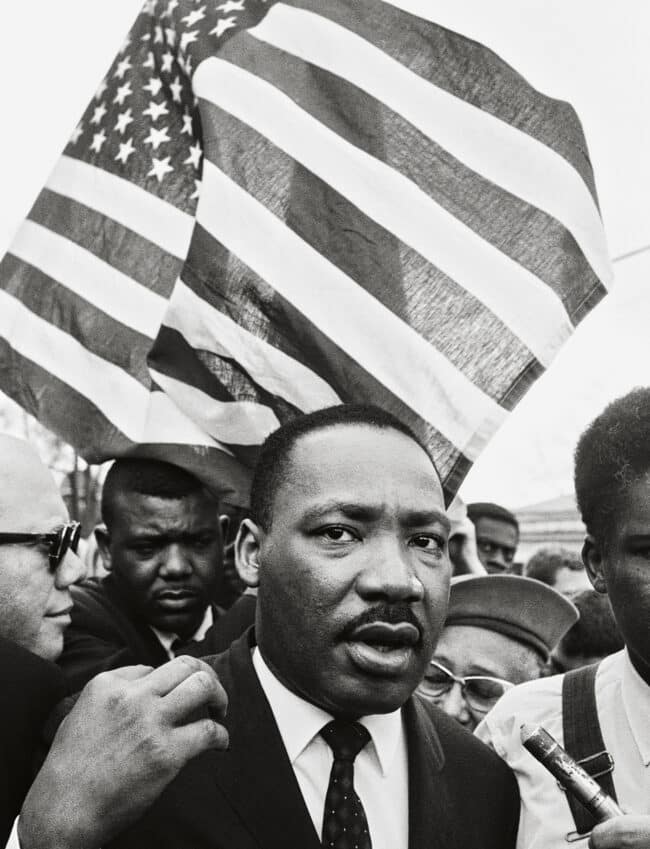 Martin Luther King, Jr. with Flag, Selma March by Steve Schapiro