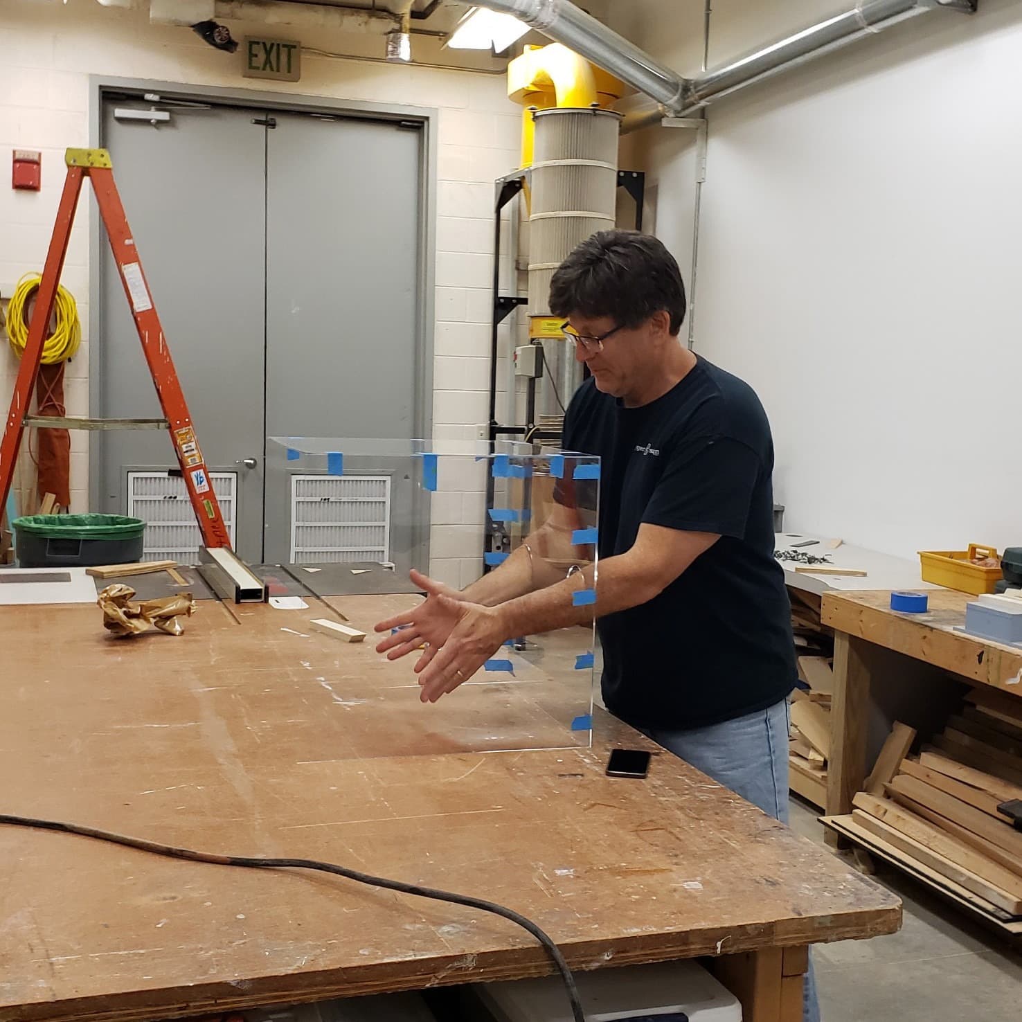 Tim Dygert, Harn Preparator & Exhibition Coordinator working on a prototype in a workshop