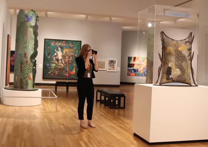 Photography intern Shelby Sieber taking photos in the gallery