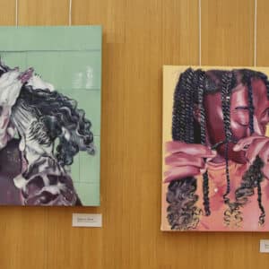Photograph of paintings by intern Jeneice Ware