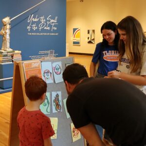 Visitors displaying their Art Cart drawings.