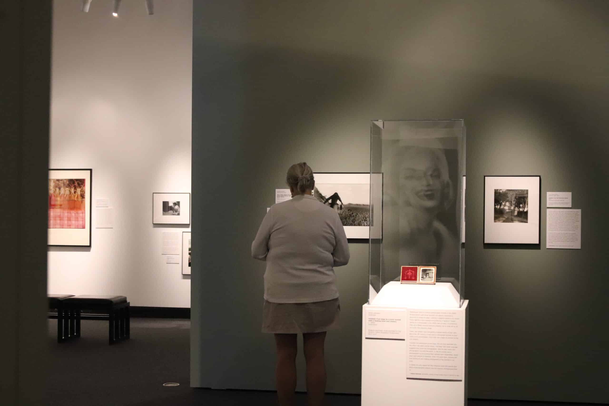 Visitor looking at a photograph in the gallery.