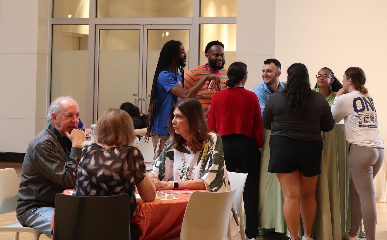 people standing and sitting, mingling, at Art After Dark