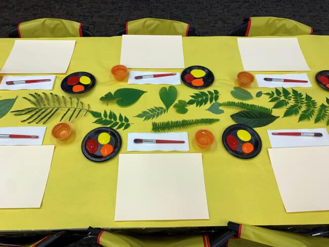 table with art-making supplies of autumnal colors