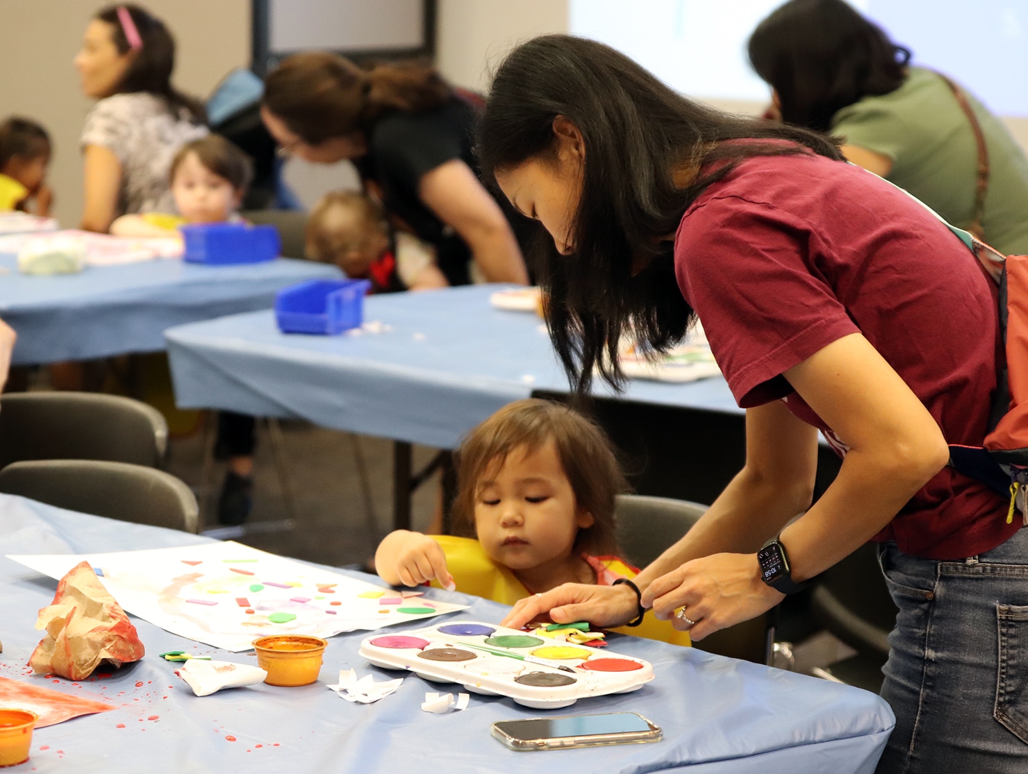 child creating art at Tot Time