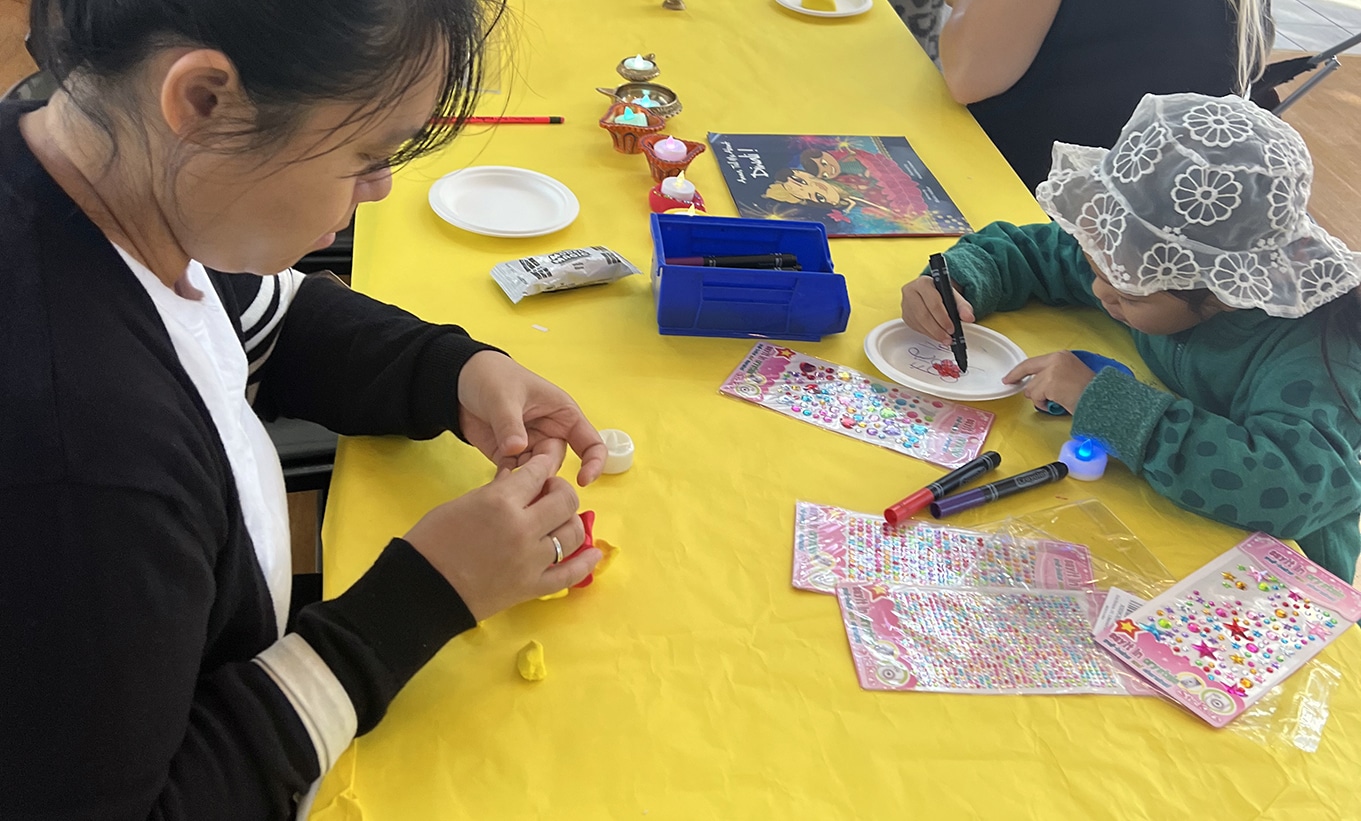 two visitors are making art at the Art Cart