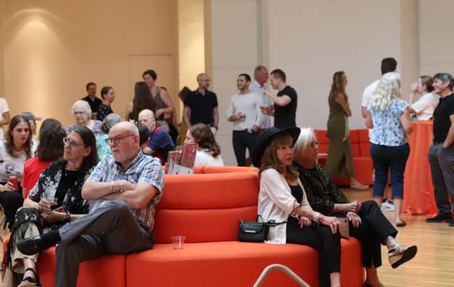 A crowd of people in the Rotunda enjoying Art After Dark evening hours