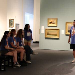 Student Engagement Manager, Errol Nelson, mentoring MUSEs in the gallery