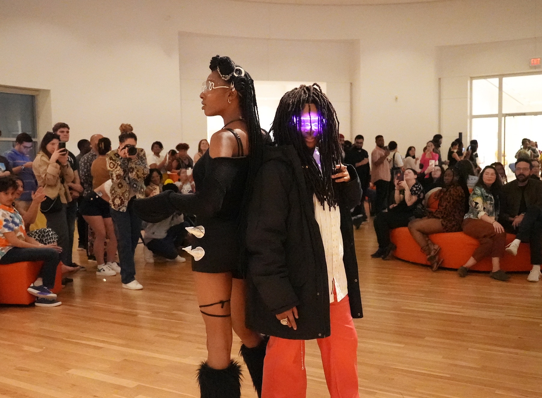 two models working the runway at the museum's Afrofuturism runway