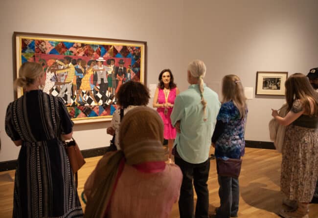 Visitors touring the "Silver Linings: Celebrating the Spelman Art Collection" exhibition