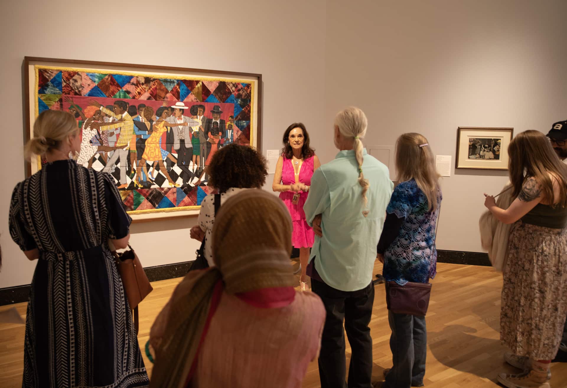 Visitors touring the "Silver Linings: Celebrating the Spelman Art Collection" exhibition