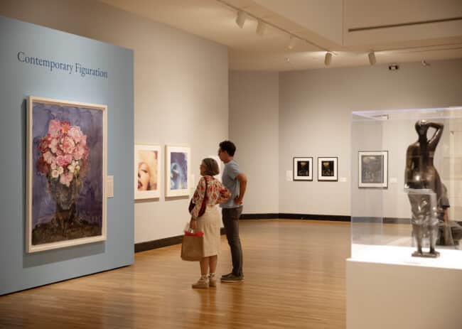 Visitors looking at the "Silver Linings" exhibition