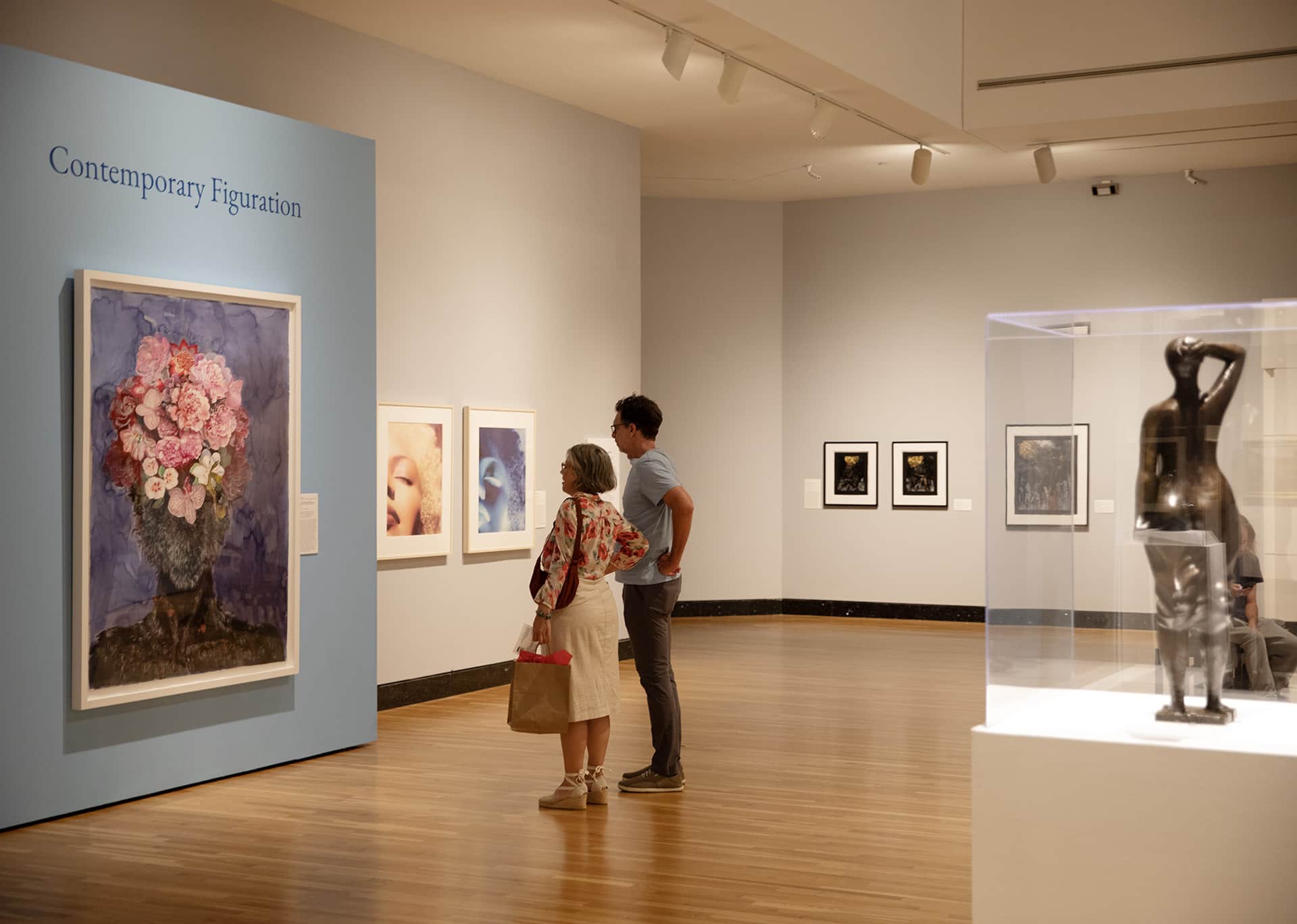 Visitors looking at the "Silver Linings" exhibition