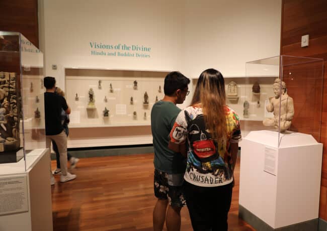 Visitors browsing a Harn gallery.