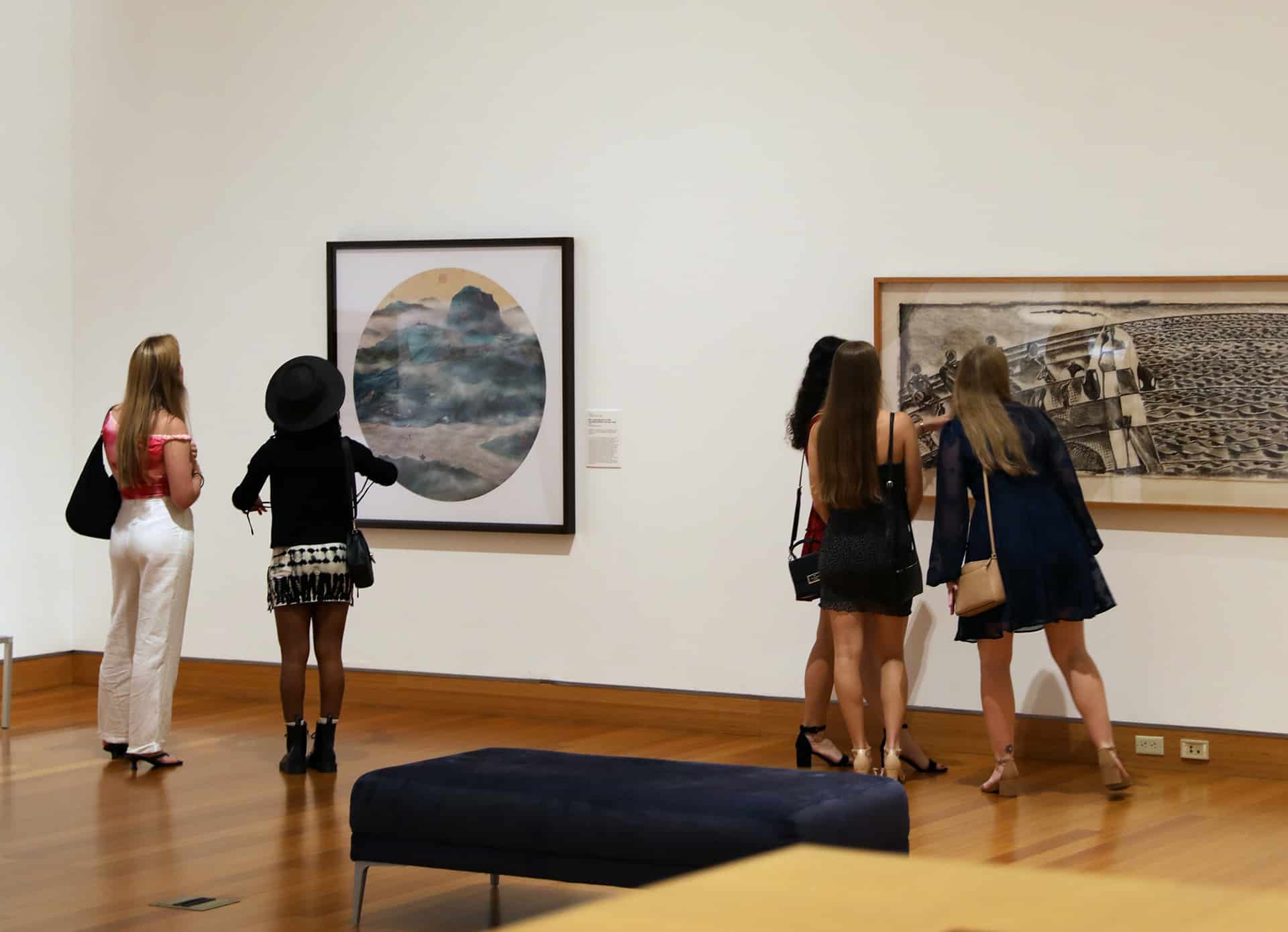Visitors browsing a Harn gallery.