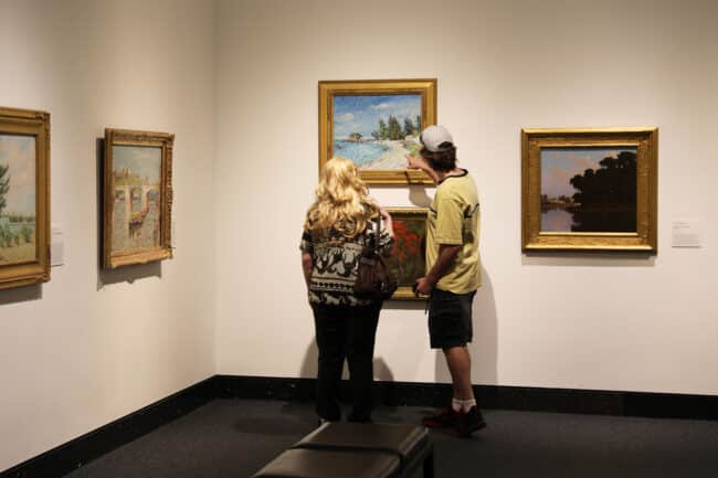 Visitors looking at art