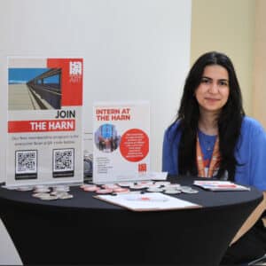 Harn intern giving out information about internships.