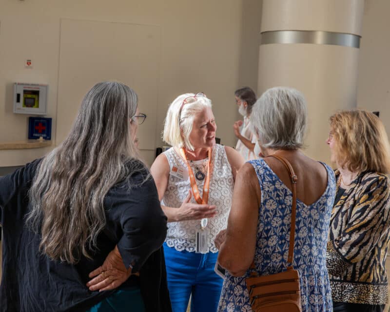 Lind Archipov talking to a group of people during Museum Nights at the Harn.